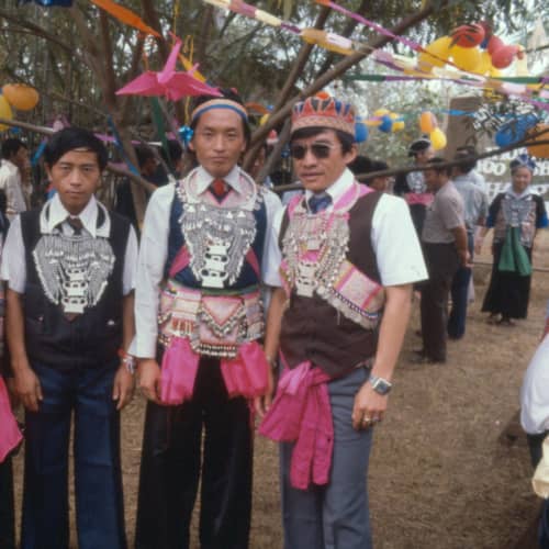 Young men in embroidered New Year jackets